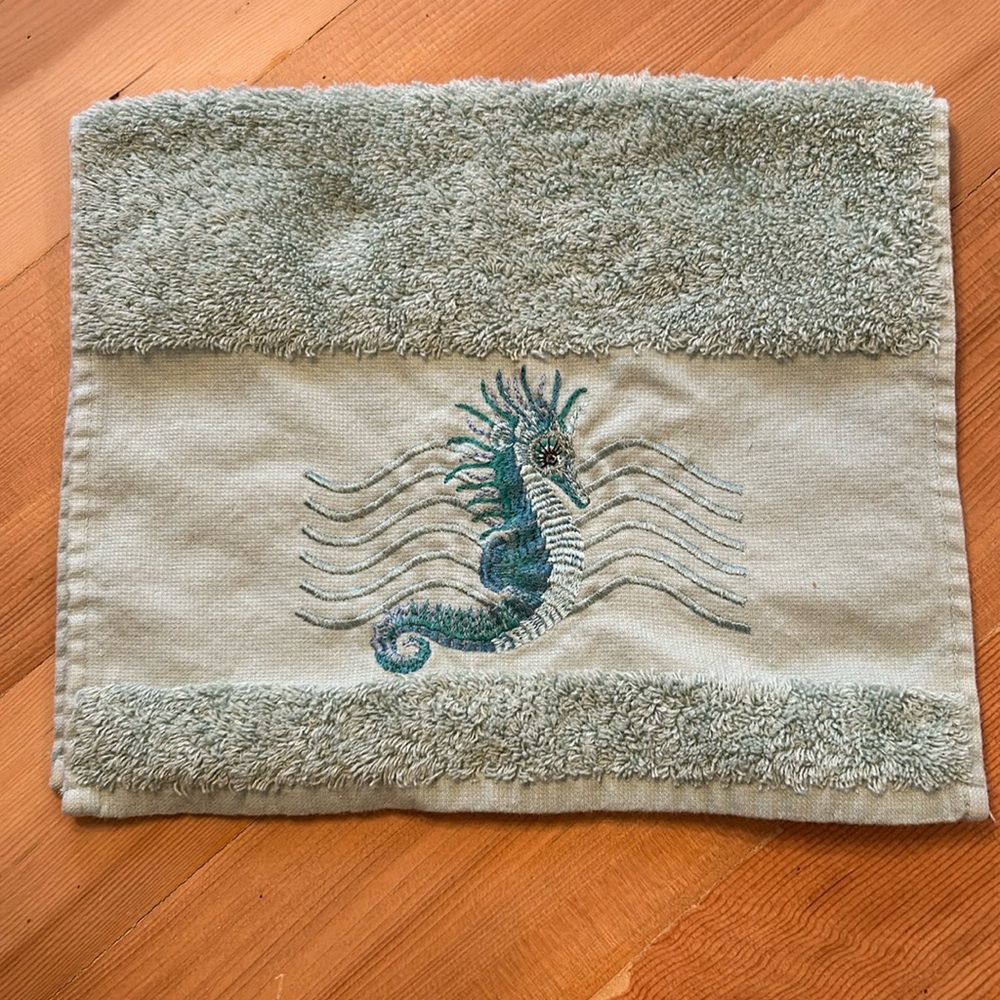 Set of 4 embroidered hand towels.